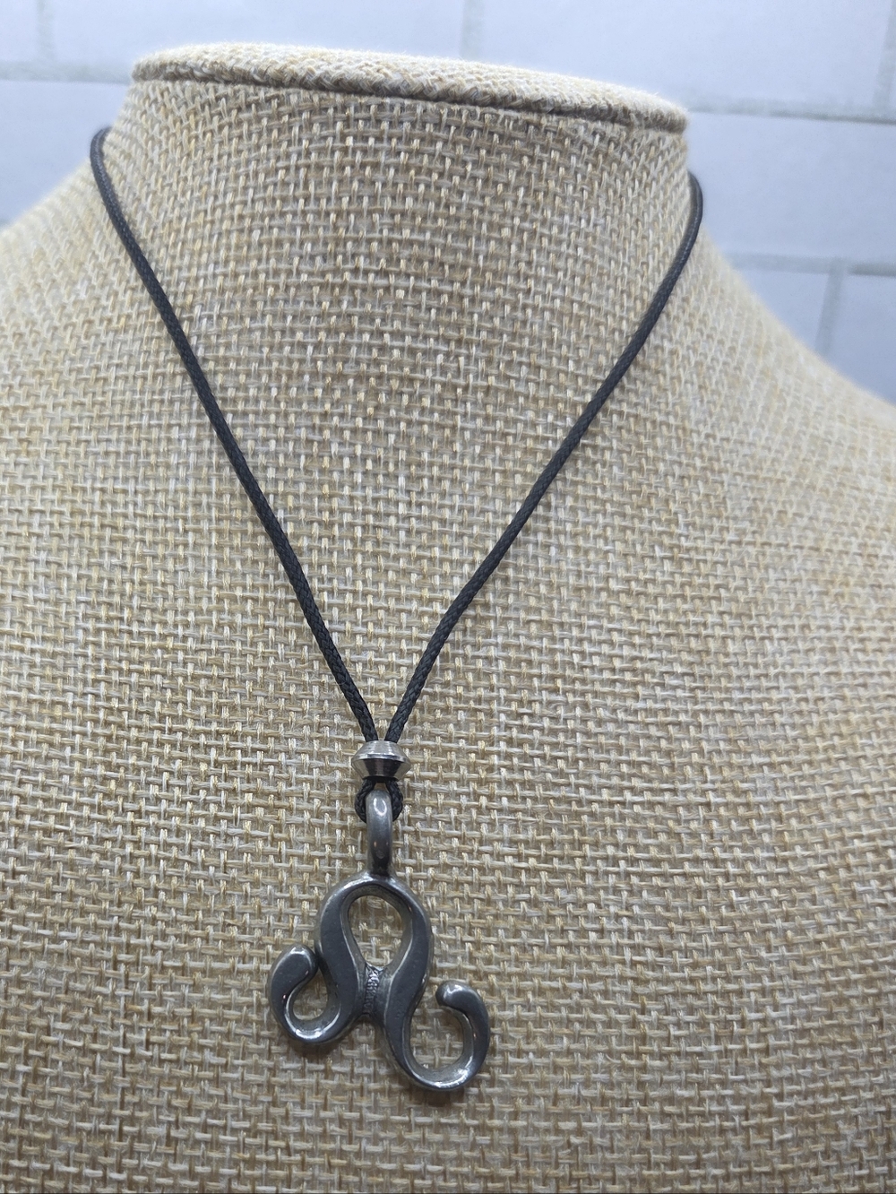 1319. Silver Tone Scroll Pendant Necklace in Black Cord